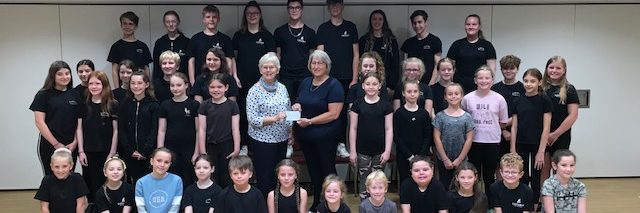 Liz Pike receives a cheque from the Castaway Theatre Group for the YCAA