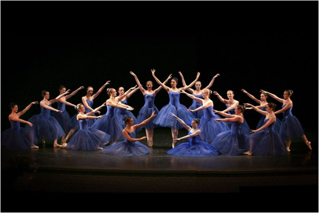 Helen Laxton dancers on stage in blue dresses
