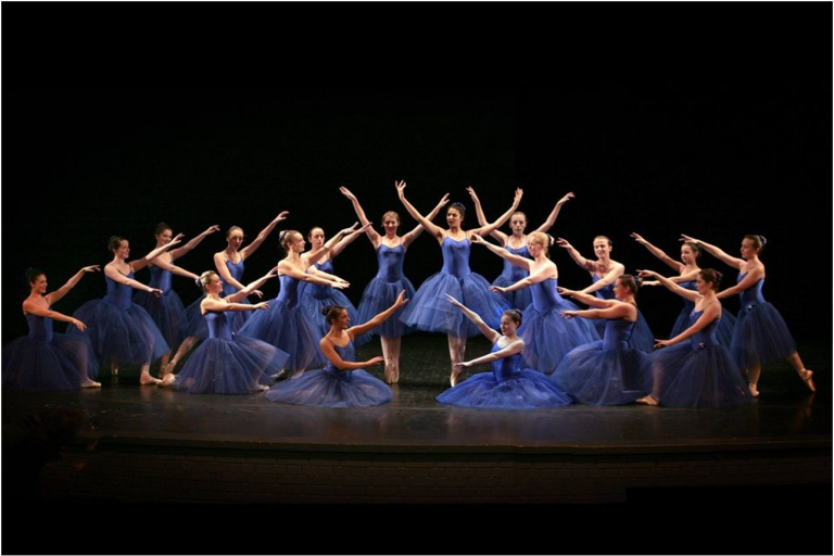Helen Laxton dancers on stage in blue dresses